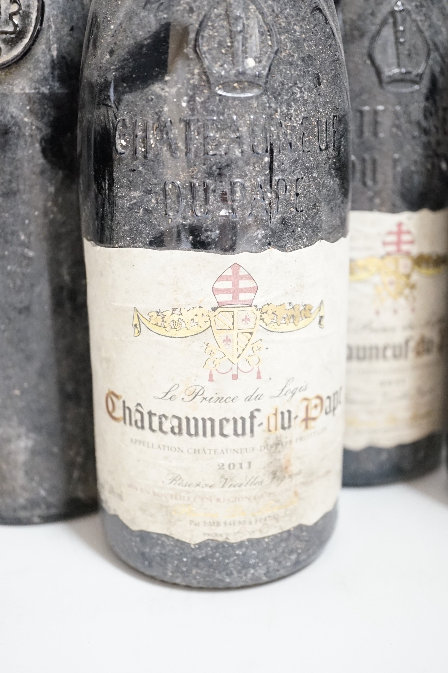 Three bottles of Chateauneuf-du-pape, One bottle of Pomerol, one bottle of port and one bottle of champagne